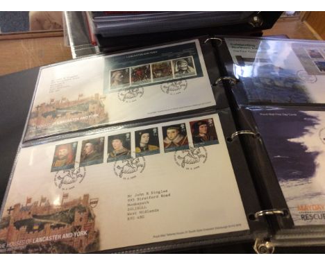 A group of eleven albums containing Elizabeth II first day covers including; British Designs, RAF, Votes for Women, Royalty, 
