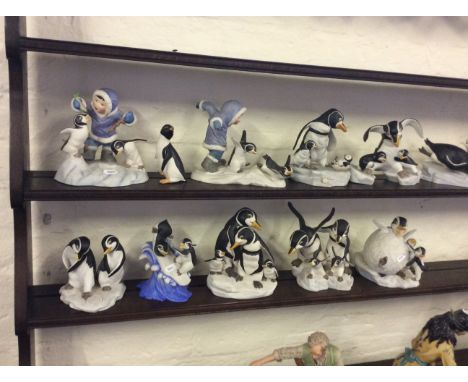 A quantity of collectable penguin ceramic figures.