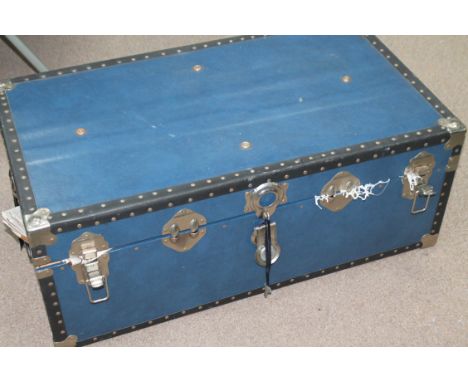TEAL BLUE VINTAGE TRAVEL TRUNK
with stud fixings and carry handles, 91cm high; containing linen and embriodery etc 