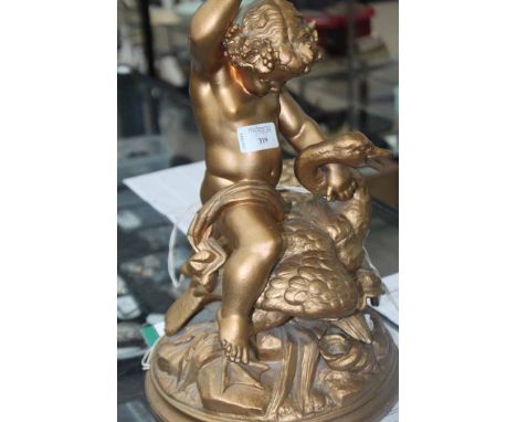 SPELTER FIGURE OF A CHERUB AND A SWAN 
in the form of a lamp