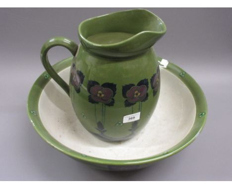 Early 20th Century pottery jug and basin set with Arts and Crafts style floral decoration 