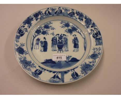 Chinese Kangxi blue and white circular dish painted with figures in a garden, six character mark within blue concentric circl