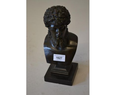 19th Century dark patinated head and shoulder bust of Hercules on a black slate plinth, unsigned, 9.75ins high overallSmall c