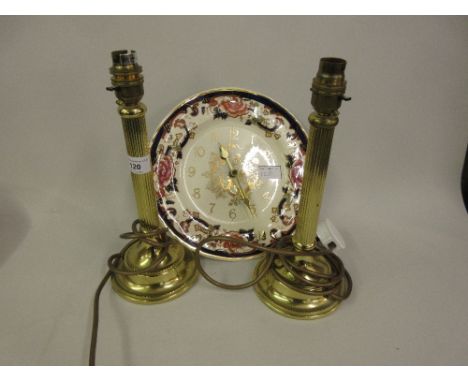 Pair of brass table lamps, a pottery wall clock formed from a plate together with a large gilt framed coloured print ' When d