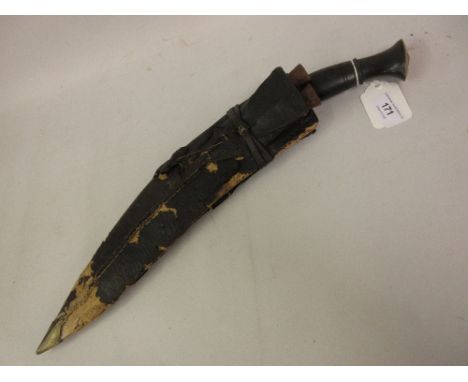 19th Century Indian kukri with a brass mounted horn grip in a leather mounted scabbard 