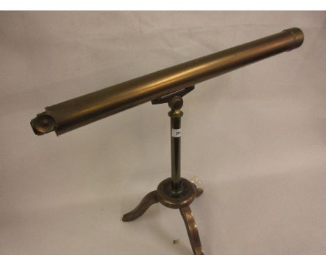 Early 20th Century brass sighting scope mounted on an iron tripod standDoes not look original to baseMissing the end as shown