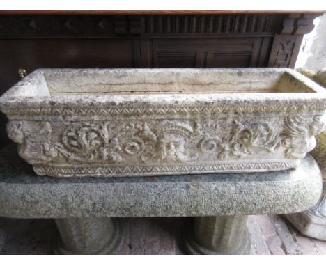 Rectangular relief moulded and cast concrete garden planter, 34ins wide and a model iron canon (at fault), barrell 33ins 
