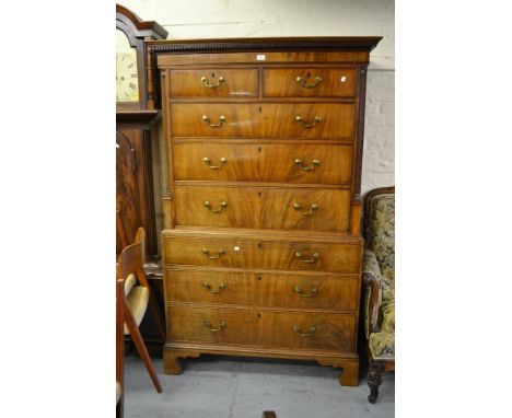 George III mahogany tallboy, the moulded dentil cornice above two short and six long graduated drawers with gilt brass swan n