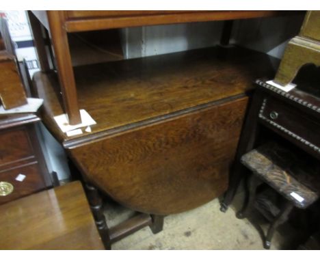 Oak oval gate leg table on baluster turned supports, a rectangular mahogany drop-leaf dining table and an early to mid 20th C