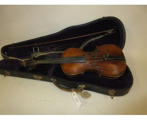 Late 19th or early 20th Century violin with a two piece 14in back, labelled to the interior ' Antonius Stradivarius ' (split 