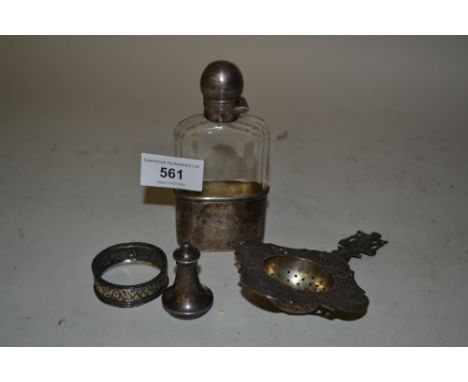 Silver mounted glass hip flask, Continental silver tea strainer, a small silver pepper and a napkin ring 