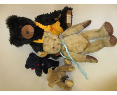 Vintage plush covered teddy bear (at fault) together with three modern teddy bears 