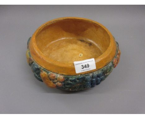 Compton pottery bowl decorated with a band of fruit in high relief, impressed marks, 8.5ins diameterHas been restored to base