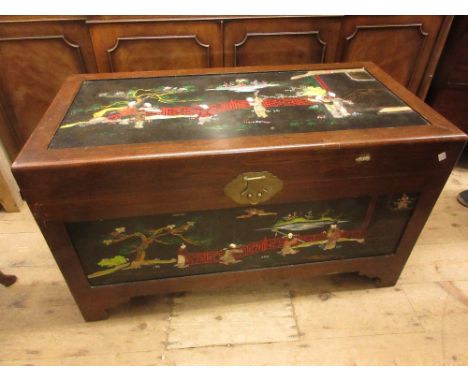 Mid 20th Century oriental lacquer decorated trunk, the hinged cover and panel front decorated with chinoiserie scenes, 40ins 