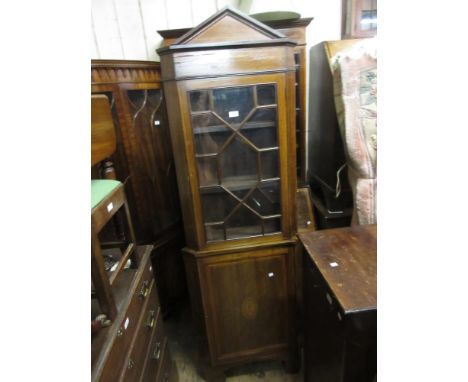 Edwardian mahogany shell and line inlaid standing corner cupboard, the architectural top above a bar glazed door and panelled