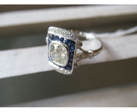 18ct White gold ring set central old cut diamond, approximately 0.9ct surrounded by sapphires and diamonds 