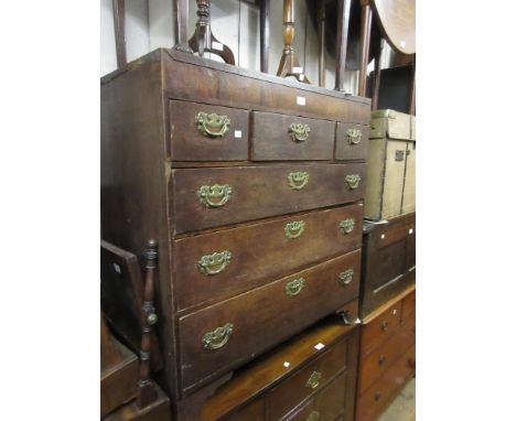 19th Century oak chest of three short over three long graduated drawers with brass handles, raised on bracket feet 