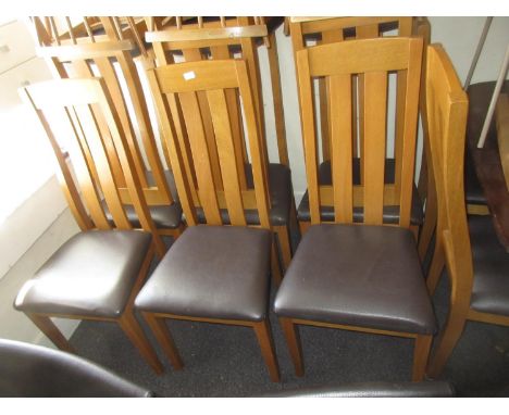 Set of twelve modern light oak dining chairs with slatted backs, padded seats and square tapering front supportsGood Conditio