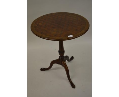 Good quality reproduction circular mahogany tilt-top pedestal table, the parquetry inlaid top on a turned column and tripod s