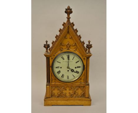 Victorian pale oak bracket clock of Gothic Revival design, the painted dial with Roman numerals, signed William Roskell and C