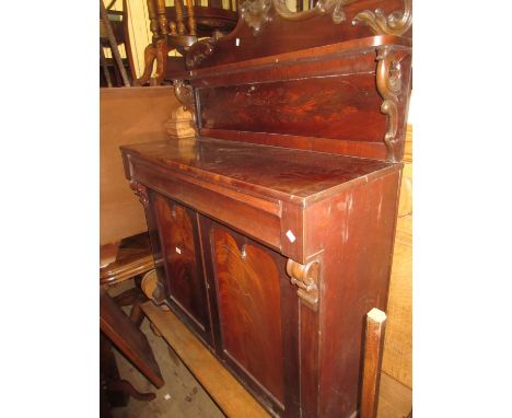 Victorian mahogany chiffonier with a carved shelf back above a moulded drawer and two panelled doors 