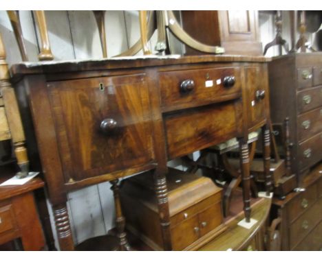 George III mahogany crossbanded and black line inlaid bow front sideboard, the figured top above two central drawers flanked 