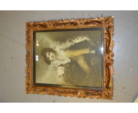 Coloured print of a boy with a rabbit in a Florentine style pierced and gilded frame 