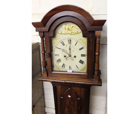 19th Century mahogany longcase clock, the arched hood above a Gothic arched panel door on a plinth base, the enamel dial with