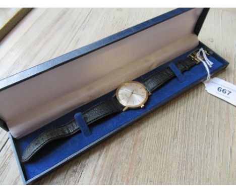 Gentleman's Omega automatic Seamaster De Ville wristwatch with a gold plated case, black leather strap and Omega buckle, the 