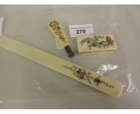 Japanese ivory page turner, an ivory handled seal and a small ivory snuff box 