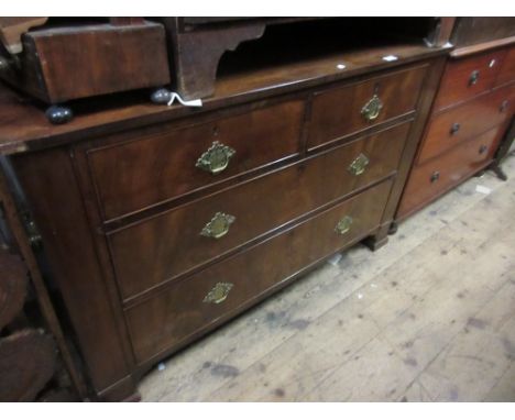 19th Century mahogany straight front chest of two short and two long drawers with brass handles and back plates raised on bra