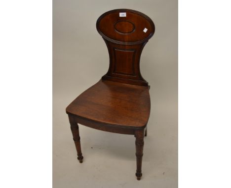 Late George III mahogany hall chair, the moulded and reeded panelled back above a plain seat on ring turned tapering front su