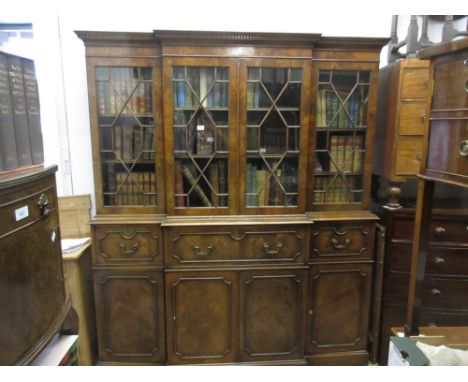 Good quality reproduction mahogany breakfront secretaire bookcase, the moulded cornice above four astragal glazed doors, the 