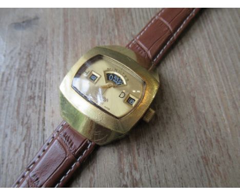Sicura 1970's wristwatch with a sweep seconds hand, day, hour and minute windows, the case 44mm x 37mm (the watch is currentl