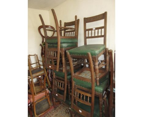 Set of eight (six plus two) late 19th Century dining chairs having carved and spindle backs with overstuffed green rexine sea