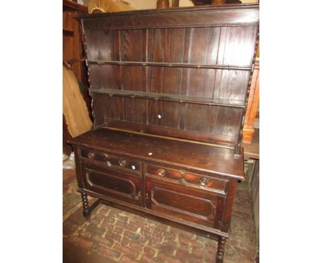 1930's Oak dresser with a boarded shelf back above two panelled doors46ins wide x 19ins deep x 75ins high 