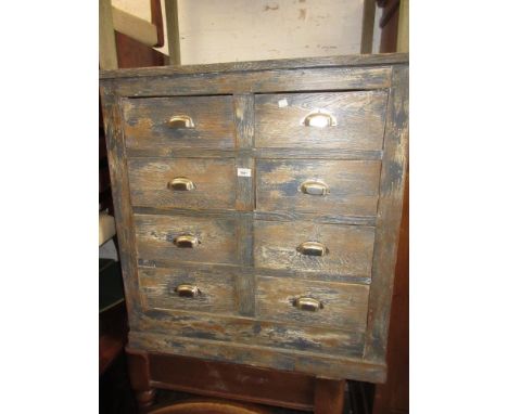 Blue painted pine bank of eight short drawers with steel cup handles, on plinth base, 37ins high x 35ins wide x 23.5ins deep 