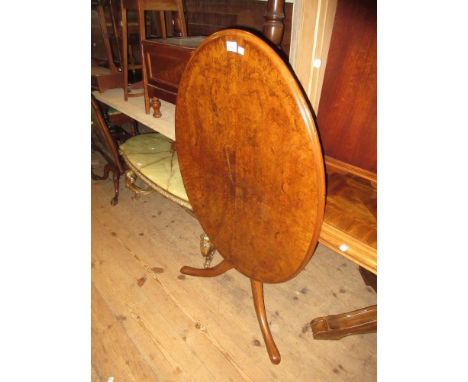 Victorian oval figured walnut tilt top table on mahogany turned centre column and tripod support 