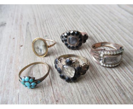 Four various 19th century memorial rings (damages), together with a 19th Century turqoise ring (at fault) 