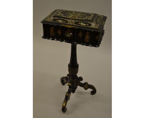 Victorian black lacquered papier mache, mother of pearl inlaid and gilt decorated work box, the hinged cover enclosing a fitt