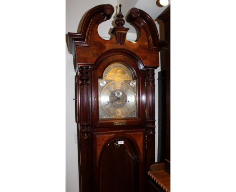 Large reproduction mahogany and figured walnut longcase clock, the broken arch pediment above bevelled glass doors and side p