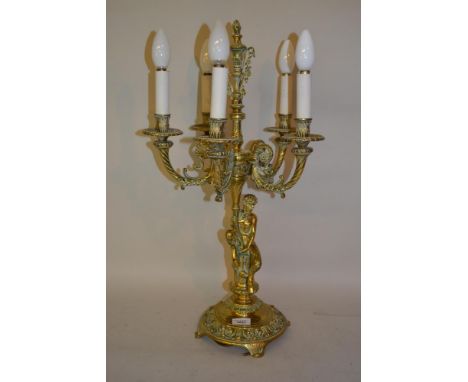 19th Century French gilt brass five light candelabra with figural column support and circular base with shaped feet 