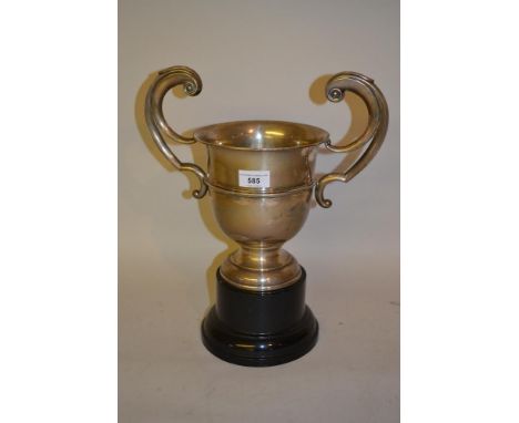 Birmingham silver two handled trophy cup on an ebonised plinth 