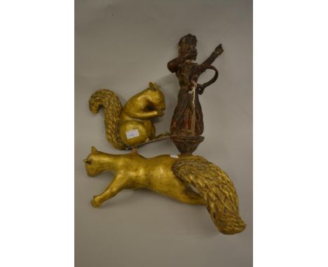 Antique carved wooden figural lamp holder, together with two 20th Century carved giltwood figures of squirrels (one at fault)