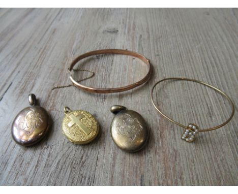 Victorian gold locket together with two other Victorian lockets and two gold banglesThe larger bangle is marked 9ct.The other