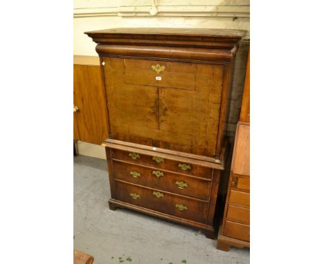 Walnut secretaire side cabinet, the fall front enclosing a fitted interior with an arrangement of pigeon holes and drawers su