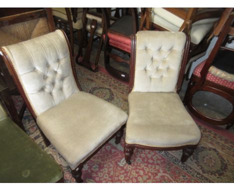 Near pair of 19th Century mahogany button upholstered nursing chairs on turned front supports 