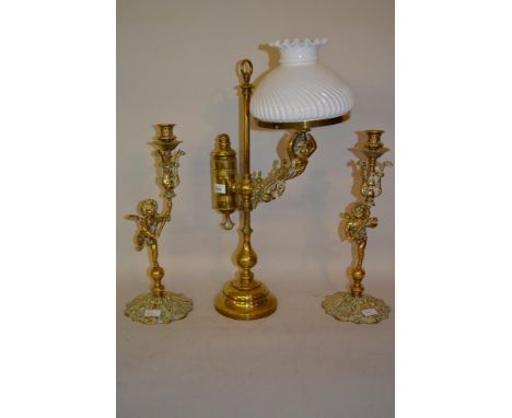 Early 20th Century brass student's lamp adapted for use with electricity with an opaque glass shade together with a pair of b