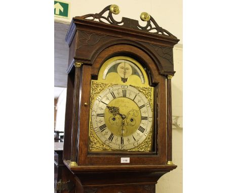 Victorian oak and mahogany crossbanded longcase clock, the broken arch hood above an arched panelled door and conforming plin