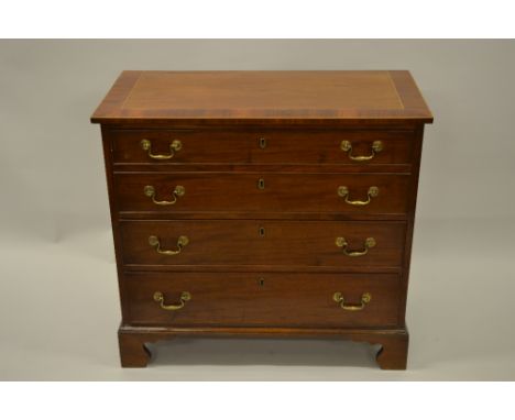 19th Century mahogany dwarf straight front chest, the crossbanded and line inlaid top above four graduated drawers with brass